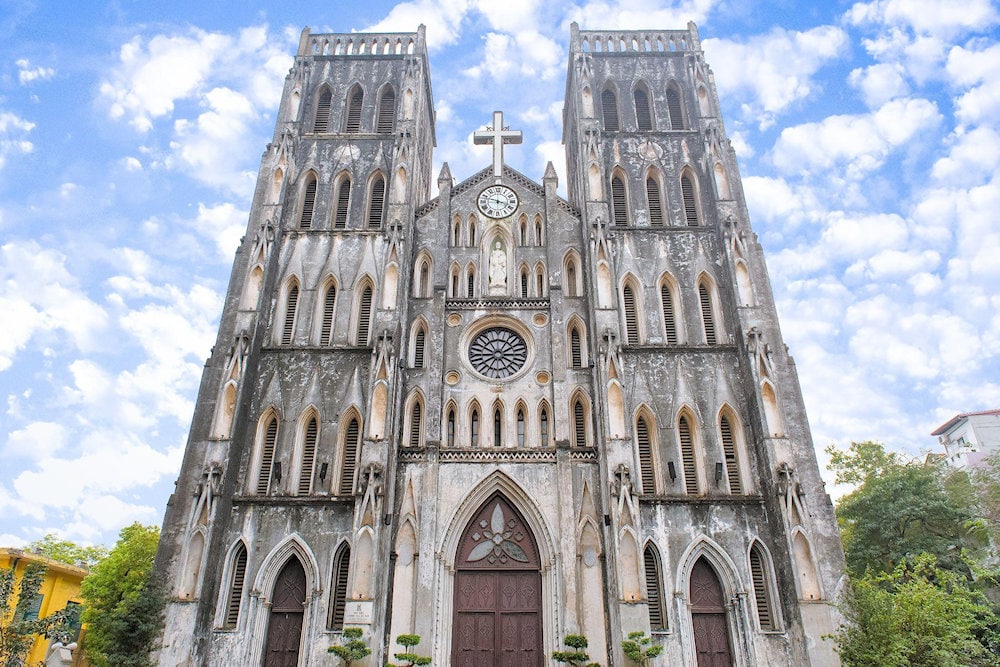 Admire the neo-Gothic elegance of St. Joseph Cathedral, a striking symbol of Hanoi’s French colonial legacy 